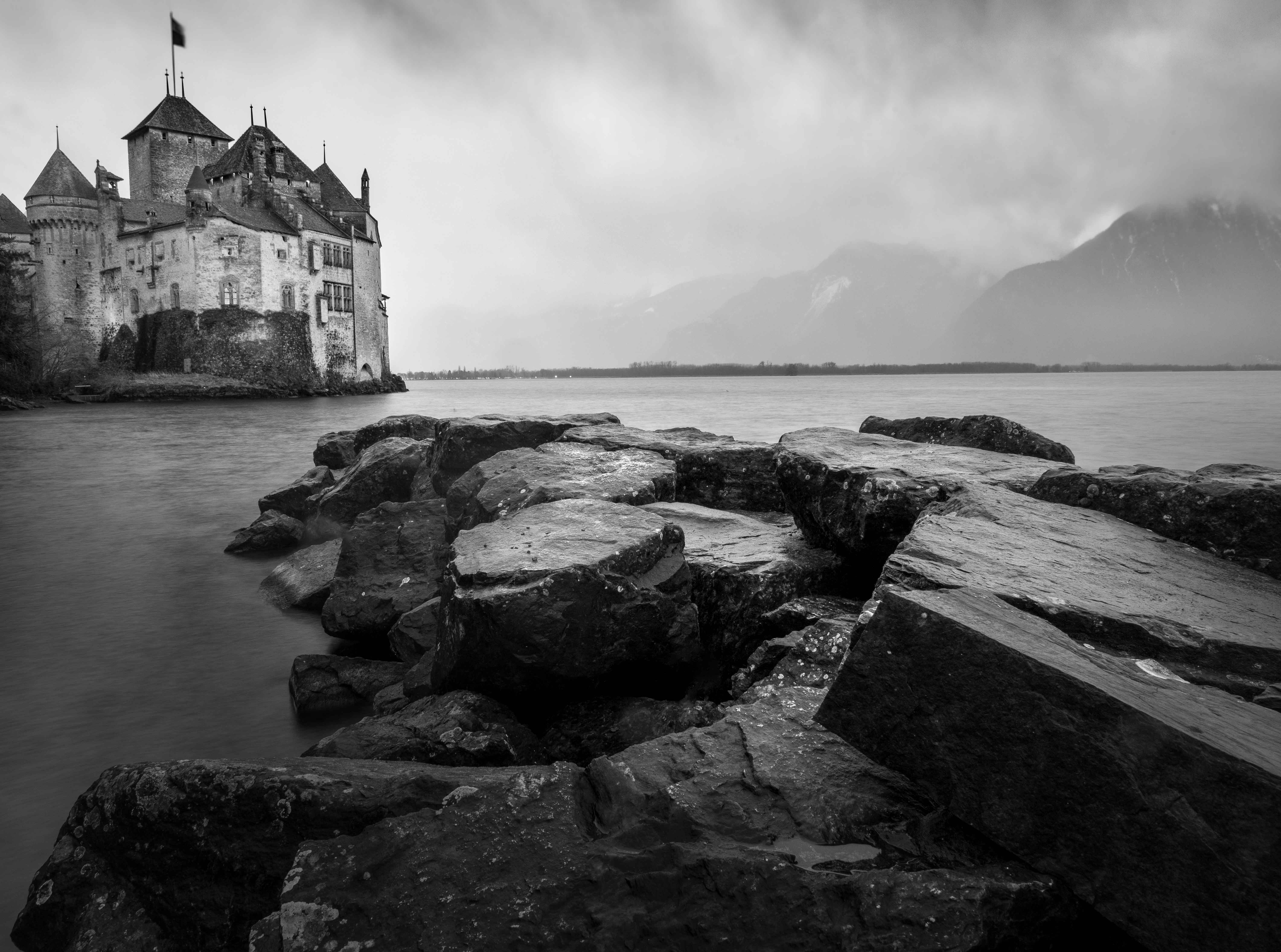Chillon Castle on Lake Geneva under storm clouds